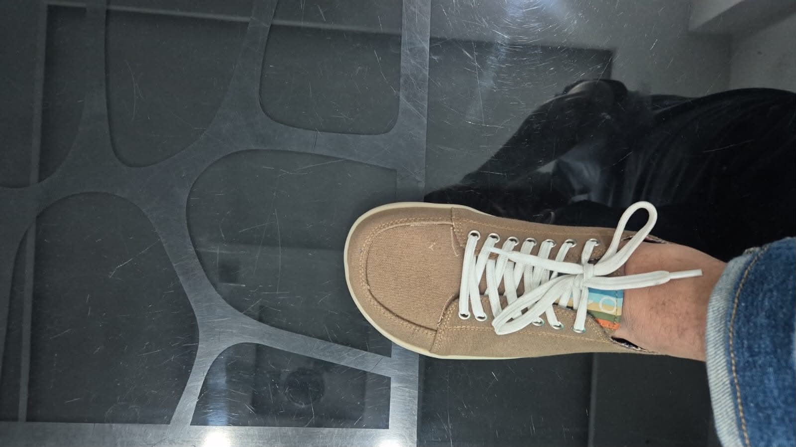 A pre-production 4.bare sneaker seen from above on a foot: wide, rounded front